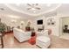 Open living area with hardwood floors, fireplace, and seamless flow to dining area and other living spaces at 1555 Water Vista Ct # 4102, Cumming, GA 30041