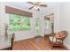 Office space with a large window, wood floors, and a comfortable chair at 1555 Water Vista Ct # 4102, Cumming, GA 30041
