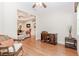 Bright office space with wood floors and a glimpse of the living area at 1555 Water Vista Ct # 4102, Cumming, GA 30041