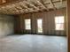 Unfinished basement space with a door and windows for natural light, ready for customization at 2335 Portrush Way (Lot 26) Dr, Atlanta, GA 30339