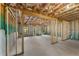 Unfinished basement with exposed wood framing, concrete walls, and visible insulation at 2335 Portrush Way (Lot 26) Dr, Atlanta, GA 30339