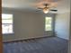 Spacious bedroom with two windows, carpet flooring, ceiling fan, and neutral paint, allowing for a calm and relaxing ambiance at 2335 Portrush Way (Lot 26) Dr, Atlanta, GA 30339