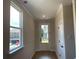 Bright entryway featuring a large window, glass-paneled door, wood floors, and white trim throughout at 2335 Portrush Way (Lot 26) Dr, Atlanta, GA 30339