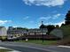 Street view of newly built townhomes on a sunny day at 2335 Portrush Way (Lot 26) Dr, Atlanta, GA 30339
