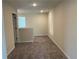 Upstairs hallway with plush carpeting and neutral paint, offering access to various rooms in the home at 2335 Portrush Way (Lot 26) Dr, Atlanta, GA 30339