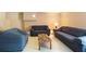 Finished basement area, ideal for use as a Gathering room or recreational space, complete with sofas and coffee table at 3161 Pagoda Trce, Lawrenceville, GA 30043