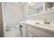 Bright bathroom with marble floors, a vanity and a large framed mirror at 3161 Pagoda Trce, Lawrenceville, GA 30043