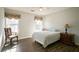 Cozy bedroom with wood floors, neutral walls, and ample natural light at 3161 Pagoda Trce, Lawrenceville, GA 30043