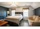 Comfortable bedroom featuring two bright windows, and a seating area at 3161 Pagoda Trce, Lawrenceville, GA 30043