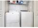 Efficient laundry area featuring a stacked washer and dryer for space-saving convenience at 3161 Pagoda Trce, Lawrenceville, GA 30043