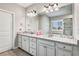 Bright bathroom with dual vanities, granite counters, and ample storage, perfect for a Primary suite at 4831 Miller Hill Rd, Buford, GA 30518