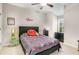 Playful bedroom with modern style bed frame, featuring an ceiling fan and decor at 4831 Miller Hill Rd, Buford, GA 30518