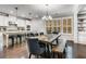 This dining room includes a large wooden table with seating and a view of the kitchen at 4831 Miller Hill Rd, Buford, GA 30518