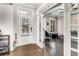 Inviting foyer with hardwood floors, French doors to an office, and a view of the front door with sidelights at 4831 Miller Hill Rd, Buford, GA 30518