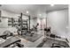 Finished basement featuring home gym with a weight rack, mirrors, and workout equipment at 4831 Miller Hill Rd, Buford, GA 30518