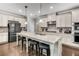 Spacious kitchen featuring granite countertops, stainless steel appliances, and a large center island with seating at 4831 Miller Hill Rd, Buford, GA 30518