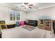 Upstairs playroom has a couch, chairs, toy organizers, a playhouse, and carpet at 4831 Miller Hill Rd, Buford, GA 30518