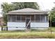 Modest single-story home with screened porch and weathered features, needing renovation at 108 Vine Sw St, Atlanta, GA 30314