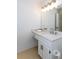 Bright bathroom with a large mirror, white cabinets, and a clean, modern sink at 307 Berkeley Woods Dr, Duluth, GA 30096
