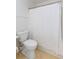 Bathroom with a toilet and shower with a shower curtain at 307 Berkeley Woods Dr, Duluth, GA 30096