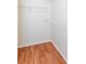 Walk-in closet featuring wire shelving and hardwood floors, offering ample storage at 307 Berkeley Woods Dr, Duluth, GA 30096