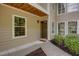 Close-up of unit entrance featuring a brown door, and garden view at 307 Berkeley Woods Dr, Duluth, GA 30096