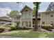 Multi-level condos with balconies, surrounded by greenery and mature trees at 307 Berkeley Woods Dr, Duluth, GA 30096