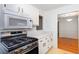 Updated kitchen featuring stainless steel appliances and gas range at 307 Berkeley Woods Dr, Duluth, GA 30096
