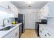 Updated kitchen with modern appliances and stainless steel refrigerator at 307 Berkeley Woods Dr, Duluth, GA 30096