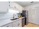 Updated kitchen featuring stainless steel appliances and quartz countertops at 307 Berkeley Woods Dr, Duluth, GA 30096