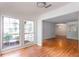 Bright living room features two large windows and hardwood floors at 307 Berkeley Woods Dr, Duluth, GA 30096