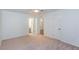 Spacious main bedroom boasts neutral carpet, a ceiling fan, and ensuite bathroom access at 307 Berkeley Woods Dr, Duluth, GA 30096