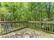 Backyard deck surrounded by trees at 7331 Wagon Wheel Ct, Jonesboro, GA 30236