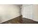 Bedroom with wood flooring and a double-door closet at 7331 Wagon Wheel Ct, Jonesboro, GA 30236