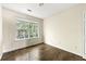 Neutral bedroom with wood flooring and a bright window at 7331 Wagon Wheel Ct, Jonesboro, GA 30236