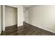 Bedroom with wood flooring and closet with shelving, offering ample storage space at 7331 Wagon Wheel Ct, Jonesboro, GA 30236