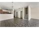 Open-concept living area features neutral paint and durable tile flooring, leading to the staircase at 7331 Wagon Wheel Ct, Jonesboro, GA 30236