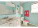 Colorful bathroom with a white vanity, bright pink accents, and whimsical decorations at 133 Parkway Dr, Fairburn, GA 30213