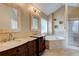 Bathroom features double vanities, soaking tub, and separate glass shower at 133 Parkway Dr, Fairburn, GA 30213