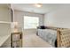 Cozy bedroom featuring a daybed, mirrored dresser, and ample natural light at 133 Parkway Dr, Fairburn, GA 30213