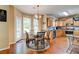 Charming breakfast nook featuring hardwood floors, glass table, and modern chandelier at 133 Parkway Dr, Fairburn, GA 30213