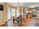 Eat-in kitchen features stainless appliances and a dining area with a glass table at 133 Parkway Dr, Fairburn, GA 30213