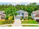 Charming two-story home with a beautifully landscaped front yard and a three-car garage at 133 Parkway Dr, Fairburn, GA 30213