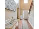 Inviting foyer with hardwood floors, elegant console table, and staircase leading to the upper level at 133 Parkway Dr, Fairburn, GA 30213