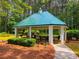 Community gazebo with seating and grills in a wooded common area at 133 Parkway Dr, Fairburn, GA 30213