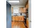 Well-lit kitchen features stainless appliances, wood cabinetry, granite counters, and tile backsplash at 133 Parkway Dr, Fairburn, GA 30213