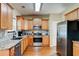 Modern kitchen featuring stainless steel appliances, granite countertops, and wood cabinets, perfect for culinary enthusiasts at 133 Parkway Dr, Fairburn, GA 30213