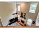 Sun-drenched living room with high ceilings, fireplace, and large windows, offering a bright and airy atmosphere at 133 Parkway Dr, Fairburn, GA 30213