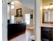 Open-concept living room with fireplace and a view of the adjacent powder room at 133 Parkway Dr, Fairburn, GA 30213