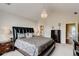 Spacious main bedroom with vaulted ceiling, chandelier, and ensuite bath at 133 Parkway Dr, Fairburn, GA 30213